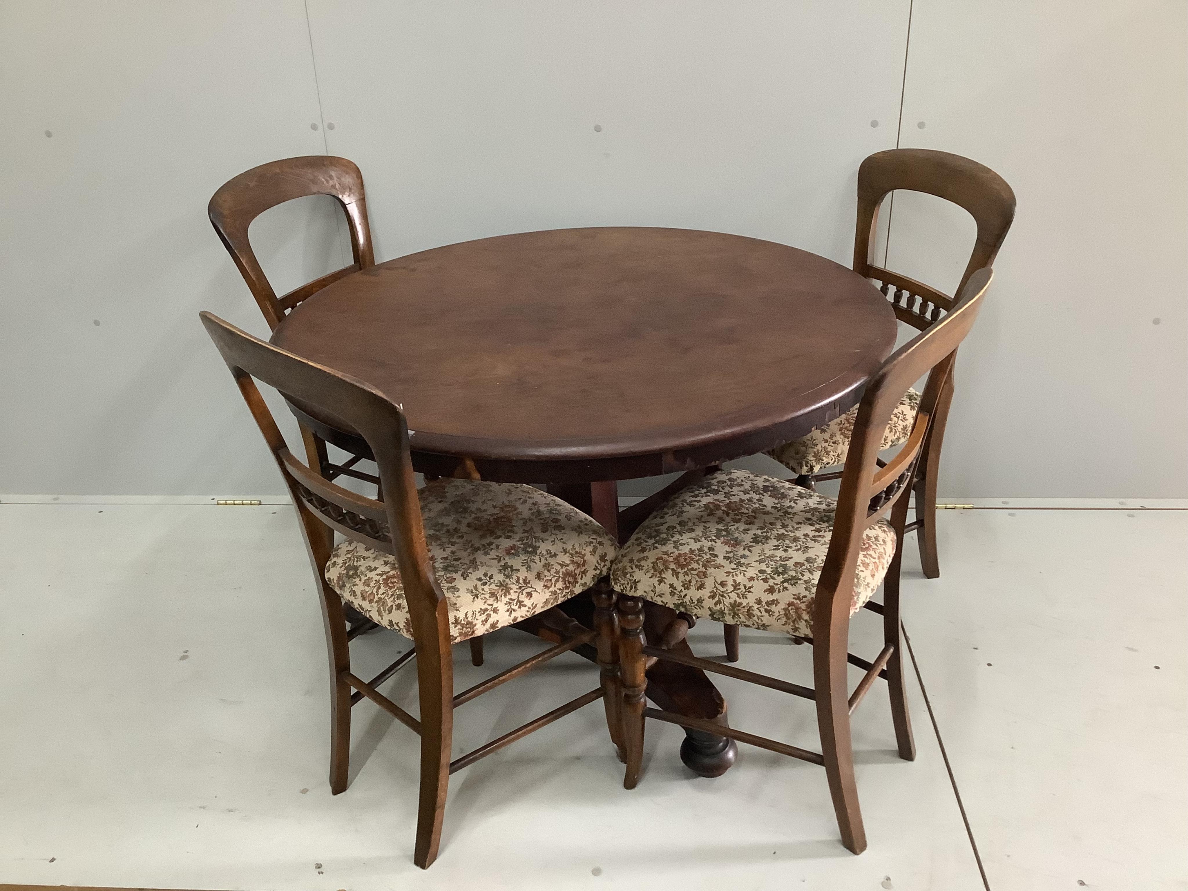 A Victorian mahogany circular tilt top breakfast table, diameter 104cm, height 71cm, together with four Victorian beech dining chairs. Condition - fair